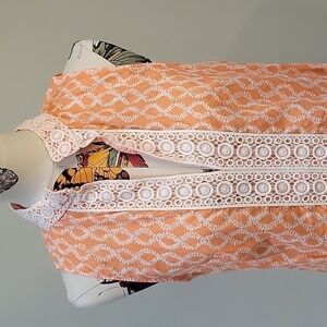 rock flower paper orange & white sleeveless tunic. Size is Large. 100% cotton.